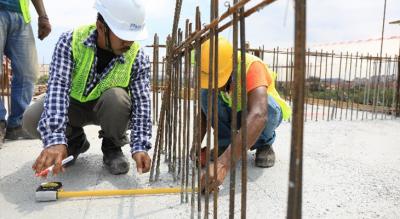 Workers installing the bracing