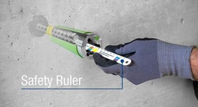 man checking depth of form tie using safety ruler